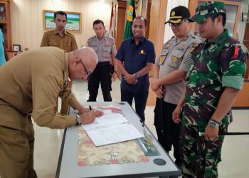 Tagop Soulisa Dengan TNI/Polri Tandatangani NPHD Pengamanan Pilkada 2020