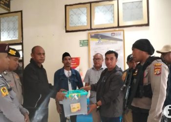 Polres Pulau Buru Kawal Hasil Rekapitulasi Perhitungan Suara Ke KPU Maluku