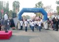Bupati Buru Ikram Umasugi Lepas 105 Peserta Gerak Jalan Indah HUT ke-27